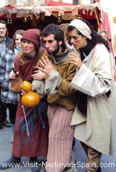 A group of medieval town drunks enjoy a drop of Spanish wine.Febuary 2011 Manresa Medieval Fair, Catalonia Spain