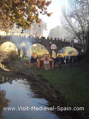 The romanesque bridge of Vic near Barcelona in Catalonia Spain. Photo of the romanesque bridge over the river taken during the medieval fair 2011.