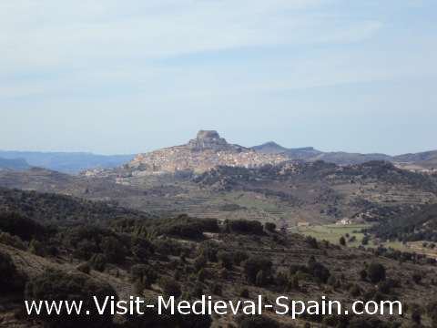 The medieval castle and town sit dramatically atop a hill which overlooks the surrounding Spanish countryside