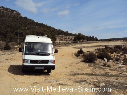 A white Mercedes camper van parked off road in the spanish countryside