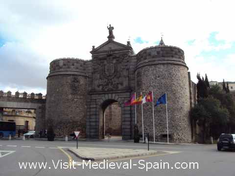 The flags of Toledo, Catite, Spain and Europe flying in front of the  Puerta Nueva Bisagra gate, Toledo.