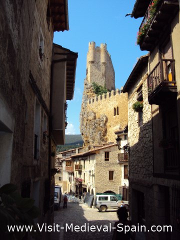 The medieval castle towers over the tiny village of Frias, Castile - Spain