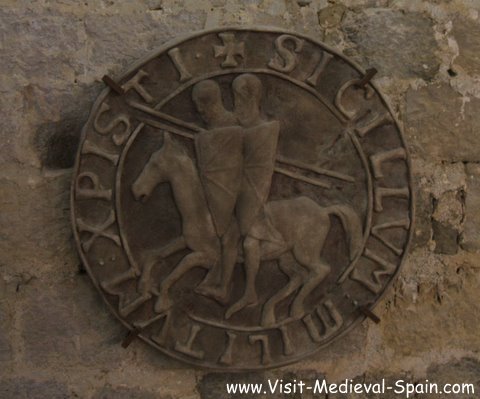 Shield in a medieval mcsatle showing Two Knights Templar on horseback