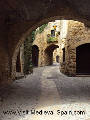 Medieval stone arches in Pals a tiny village near Girona, Spain